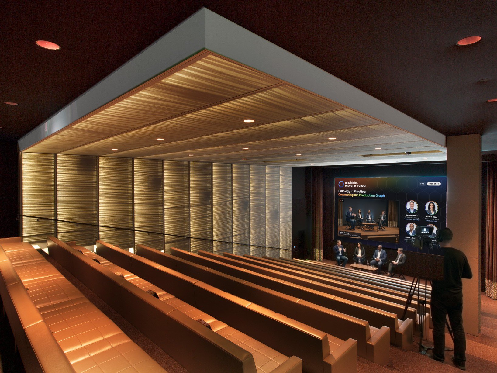 UTA theatre from the back row, screen showing the MovieLabs Industry Forum panel layout