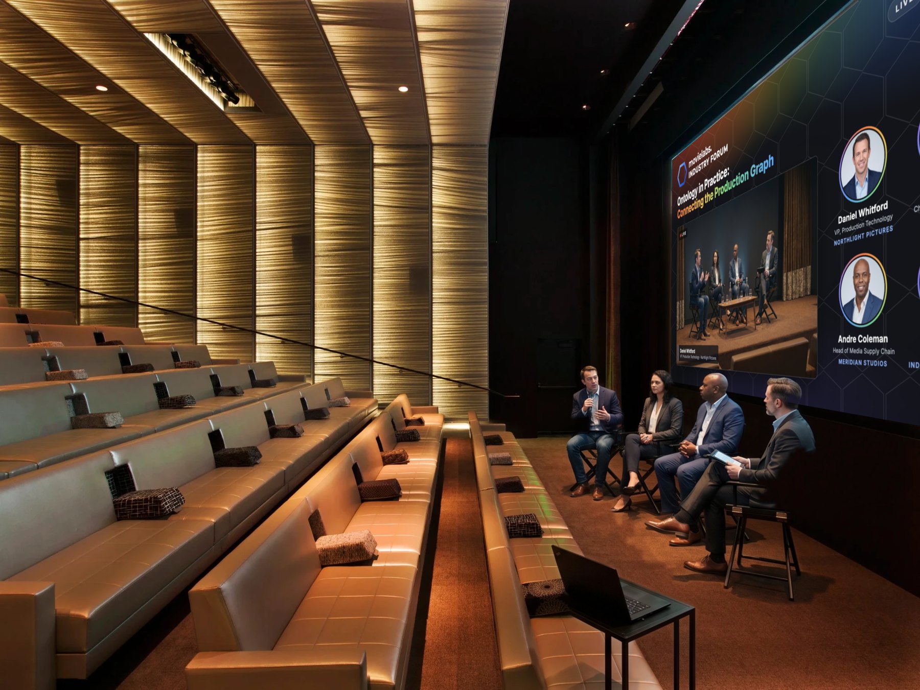 UTA theatre from the side, screen showing the MovieLabs Industry Forum panel layout
